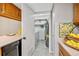 Laundry room featuring appliances, storage, and adjacent access to the kitchen at 9411 W 89Th Cir, Westminster, CO 80021