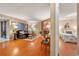 Inviting living room featuring a stone fireplace, seamlessly connected to the primary bedroom at 9411 W 89Th Cir, Westminster, CO 80021