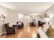 Inviting living room featuring hardwood floors, comfortable seating, and a cozy dining area at 9411 W 89Th Cir, Westminster, CO 80021