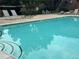 Outdoor pool with lounge chairs and tables provides a relaxing space for residents and guests at 9411 W 89Th Cir, Westminster, CO 80021