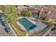 Aerial view of the community pool with a safety cover, surrounded by lush greenery at 9411 W 89Th Cir, Westminster, CO 80021