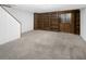 Basement area with bookshelves, lounge area, and carpet floors at 19618 Rosewood Ct, Parker, CO 80138