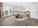 Inviting living room with stone fireplace, comfortable seating, and natural light at 19618 Rosewood Ct, Parker, CO 80138