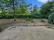 Backyard featuring mature trees and lush greenery provides a private outdoor space for leisure and recreation at 3661 S Joplin St, Aurora, CO 80013