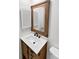 Stylish bathroom boasts a modern vanity, mirror, and fixtures, creating a sleek and functional space at 3661 S Joplin St, Aurora, CO 80013