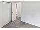Bedroom featuring neutral carpet and paint, with an open closet and view into another room at 3661 S Joplin St, Aurora, CO 80013