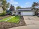 Charming two-story home featuring a well-manicured front yard and attached two-car garage at 3661 S Joplin St, Aurora, CO 80013