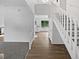 Bright foyer featuring new flooring and access to the kitchen at 3661 S Joplin St, Aurora, CO 80013
