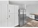 Kitchen featuring white cabinetry, stainless steel refrigerator, and wood-look flooring at 3661 S Joplin St, Aurora, CO 80013