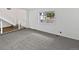 This large, empty living room has new paint and updated carpet at 3661 S Joplin St, Aurora, CO 80013