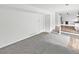Open living area with carpet, new flooring and access to kitchen and second floor at 3661 S Joplin St, Aurora, CO 80013
