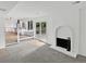 Open-concept living area with fireplace and sliding glass doors leading to the backyard at 3661 S Joplin St, Aurora, CO 80013