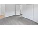 Carpeted main bedroom with closets and doorway to en-suite bathroom at 3661 S Joplin St, Aurora, CO 80013