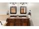 Bathroom featuring granite counters, double sinks, and custom wood cabinetry at 50 Cooney Ct, Breckenridge, CO 80424