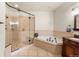 Spacious bathroom featuring a jacuzzi tub, walk-in shower and tile flooring at 50 Cooney Ct, Breckenridge, CO 80424