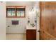 Bathroom featuring wood window trim, bronze fixtures, and tile flooring at 50 Cooney Ct, Breckenridge, CO 80424