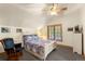Bedroom featuring a ceiling fan, wood trim window, and white furnishings at 50 Cooney Ct, Breckenridge, CO 80424