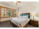Bedroom with a large window and wooden headboard at 50 Cooney Ct, Breckenridge, CO 80424