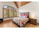 Cozy bedroom featuring a large window with wooded views and a comfortable, stylish bed at 50 Cooney Ct, Breckenridge, CO 80424