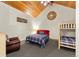 Bedroom featuring vaulted ceilings, bunk beds, and plaid bedding at 50 Cooney Ct, Breckenridge, CO 80424