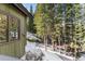 Scenic view of the home's exterior and wooded surroundings, showcasing the natural beauty of the location at 50 Cooney Ct, Breckenridge, CO 80424
