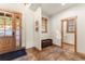 Spacious foyer with tile flooring, wooden accents, and a bench that leads to the main living areas at 50 Cooney Ct, Breckenridge, CO 80424