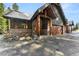 Inviting exterior with stone accents, wood beams, and a three-car garage adds to the curb appeal at 50 Cooney Ct, Breckenridge, CO 80424