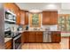 Well-equipped kitchen featuring wood cabinetry, granite countertops, and stainless steel appliances at 50 Cooney Ct, Breckenridge, CO 80424