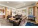 Open-concept finished basement with a stone fireplace, pool table, and wet bar at 50 Cooney Ct, Breckenridge, CO 80424
