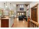 Open-concept living space featuring hardwood floors, high ceilings, and an abundance of natural light at 50 Cooney Ct, Breckenridge, CO 80424