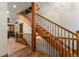 Elegant staircase with wood and iron railings provides access to the upper level of the home at 50 Cooney Ct, Breckenridge, CO 80424