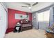 Charming bedroom with red and grey accent wall at 10251 Rifle St, Commerce City, CO 80022