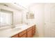 Bathroom featuring double sinks with lots of counter space and large mirror with vanity lighting at 9973 E Carolina Cir # 104, Aurora, CO 80247