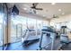 Fitness center featuring treadmills, stationary bikes, ceiling fans and large windows at 9973 E Carolina Cir # 104, Aurora, CO 80247