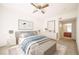 Serene bedroom with a plush bed, modern decor, and an ensuite bathroom at 9973 E Carolina Cir # 104, Aurora, CO 80247