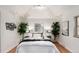 Cozy bedroom with bright natural light, hardwood floors, and vaulted ceiling at 2745 N Saint Paul St, Denver, CO 80205