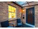 Charming front porch with seating, stylish door, and brick facade creating an inviting entrance at 2745 N Saint Paul St, Denver, CO 80205