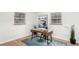 Bright home office space featuring hardwood floors, two large windows, and modern desk setup at 2745 N Saint Paul St, Denver, CO 80205
