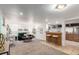 Finished basement living room with carpet flooring, recessed lighting, and bar with seating at 2745 N Saint Paul St, Denver, CO 80205