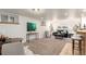 Finished basement living room area with carpet flooring, recessed lighting, and bright natural light at 2745 N Saint Paul St, Denver, CO 80205