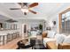Open-concept living and dining area with hardwood floors, stylish furniture, and great natural light at 2745 N Saint Paul St, Denver, CO 80205