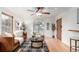 Cozy living room featuring hardwood floors, a comfortable sofa, and an arched window at 2745 N Saint Paul St, Denver, CO 80205