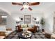 Bright living room featuring hardwood floors, a stylish sofa, and contemporary decor at 2745 N Saint Paul St, Denver, CO 80205