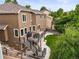 Aerial view of backyard with deck, patio, and well-maintained lawn at 10235 Rustic Redwood Ln, Highlands Ranch, CO 80126