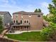Spacious backyard with deck, patio, and well-maintained lawn at 10235 Rustic Redwood Ln, Highlands Ranch, CO 80126