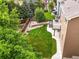 Aerial view of the house showing the deck, patio and expansive lawn at 10235 Rustic Redwood Ln, Highlands Ranch, CO 80126