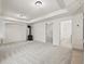 Finished basement with a carpeted floor and a stone fireplace feature at 10235 Rustic Redwood Ln, Highlands Ranch, CO 80126
