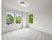 Sunlit bedroom with three large windows offering green views at 10235 Rustic Redwood Ln, Highlands Ranch, CO 80126