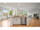 Open kitchen layout with granite island and stainless steel appliances at 10235 Rustic Redwood Ln, Highlands Ranch, CO 80126