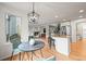 Modern kitchen and dining area with an open floor plan at 10235 Rustic Redwood Ln, Highlands Ranch, CO 80126